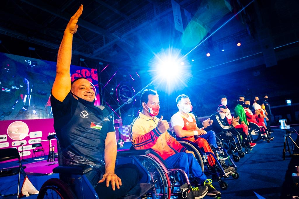 International para powerlifting athletes in wheelchairs greeting the crowd